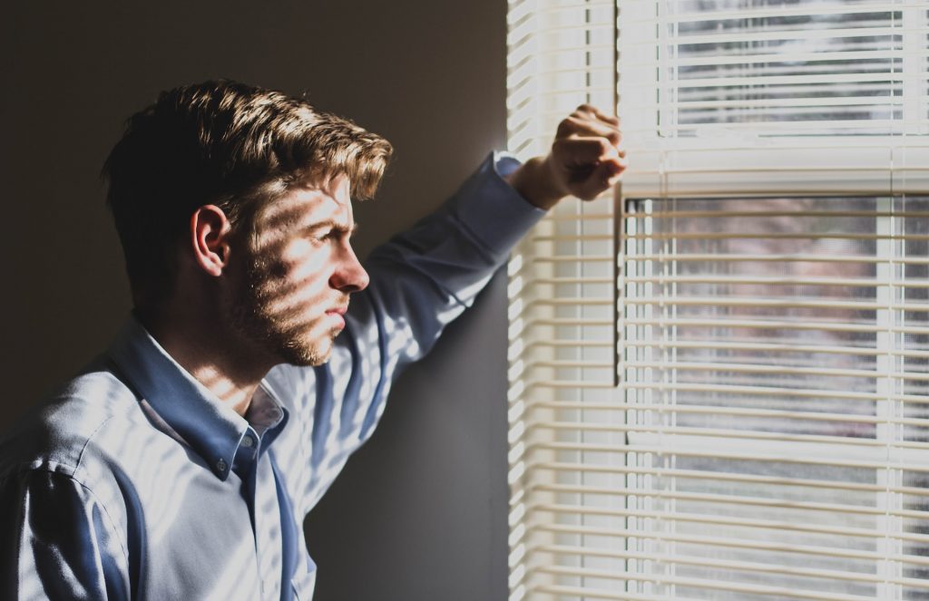 A person looking through a window